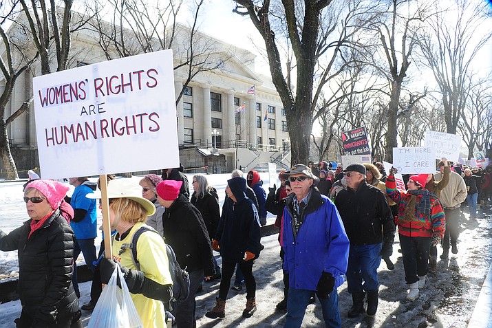 An estimated crowd of 1,200 women, men and children march in the Women's March around the Yavapai County Courthouse in Prescott one year ago. The march on the sidewalk wound completely around the courthouse plaza. (Les Stukenberg/Courier, file)