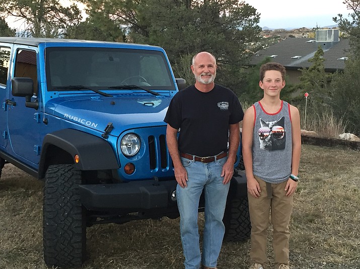 “Big” Jim Geiss and “Little” Christopher Wendt standing with the Jeep they use for so many of their adventures. (Courtesy)