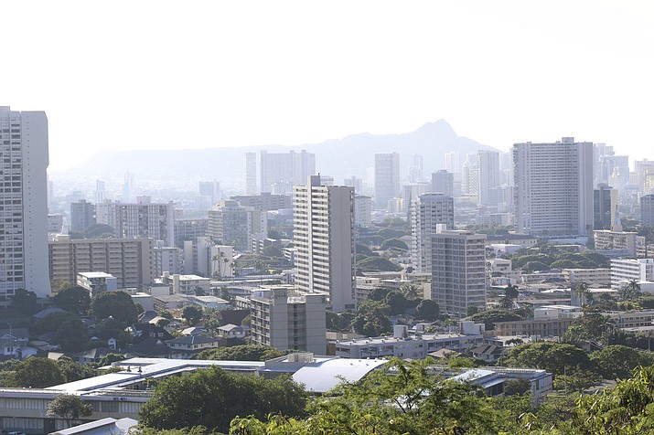 Diamond Head, an extinct volcanic crater, and high-rises are seen in Honolulu on Saturday, Jan. 13, 2018. A push alert that warned of an incoming ballistic missile to Hawaii and sent residents into a full-blown panic was a mistake, state emergency officials said. (AP Photo/Audrey McAvoy)