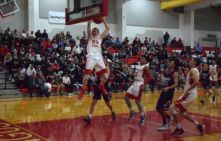 Mingus senior Alex Figy slam dunks during the Marauders’ 76-62 win over Scottsdale Christian at home on Thursday night. Figy scored 19 points and dunked twice. (VVN/James Kelley)