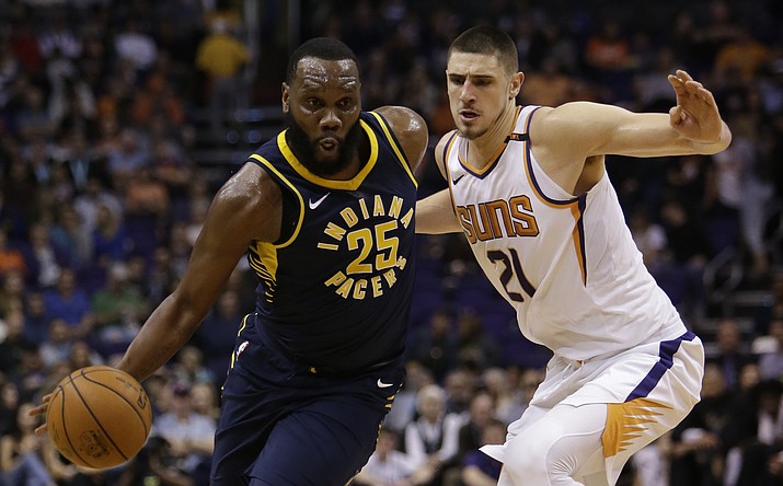 Indiana Pacers center Al Jefferson (25) drives past Suns center Alex Len in the first half during an NBA basketball game, Sunday, Jan. 14, in Phoenix. (Rick Scuteri/AP)