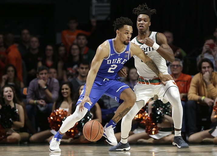 Duke’s Gary Trent Jr (2) drives as Miami’s Lonnie Walker IV defends during the second half Monday, Jan. 15, 2018, in Coral Gables, Fla. (Lynne Sladky/AP)
