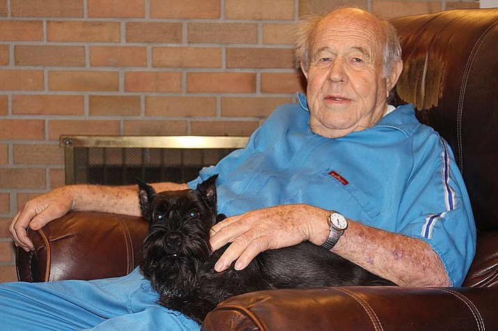 Eddie Pattillo, with his dog, Sally, is among the survivors of Mohave County Downwinders, a group of people who were exposed to low doses of radiation during testing of nuclear weapons in Nevada during the 1950s. )Hubble Ray Smith/Kingman Daily Miner)