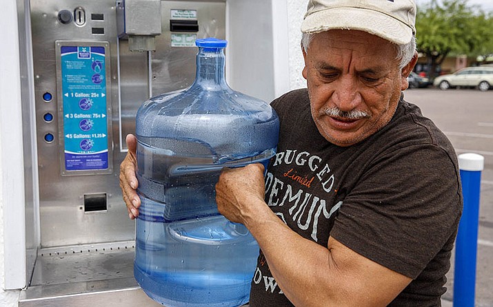 Francisco Tavira, 62, earns $12 an hour at Sierra Sun Landscaping in Tempe and spends about $20 a month to refill his water bottles.