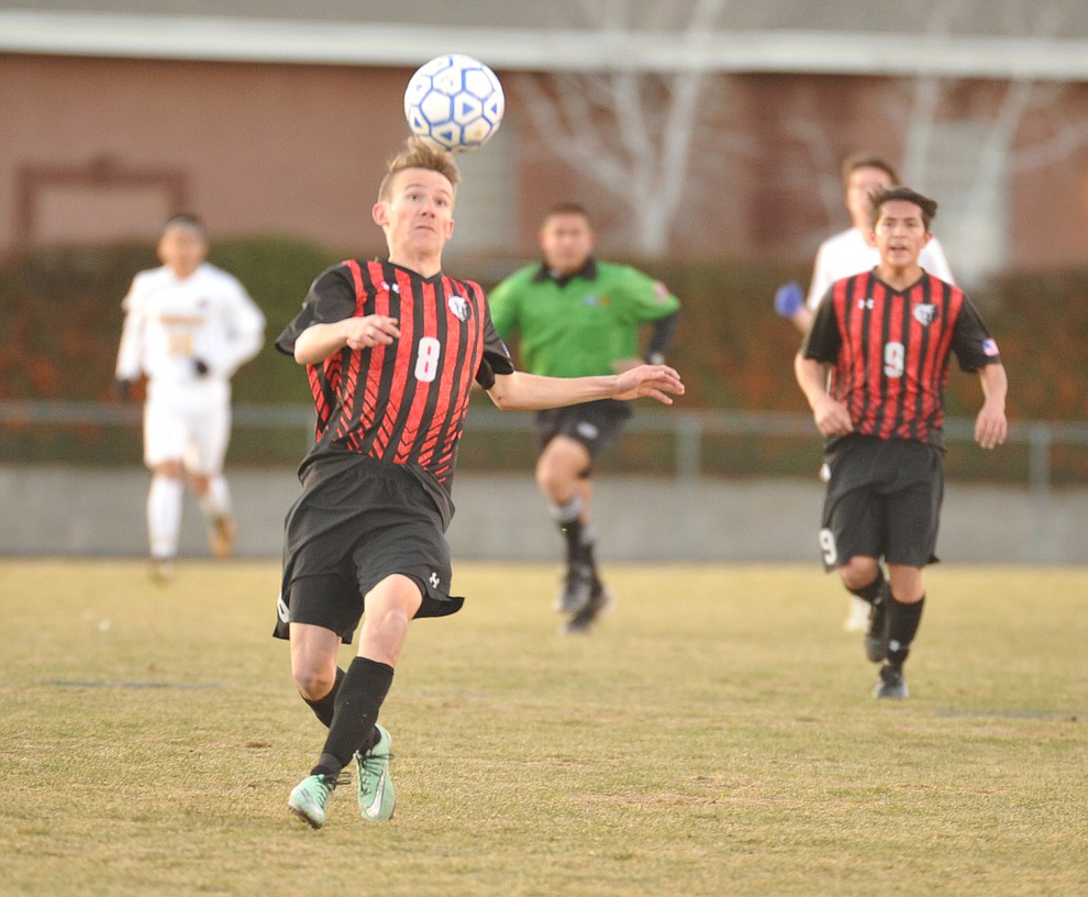 Bradshaw Mountain's Kyle Spencer heads the ball as the Bears traveled to cross town rival Prescott in a soccer double header Tuesday. (Les Stukenberg/Courier)