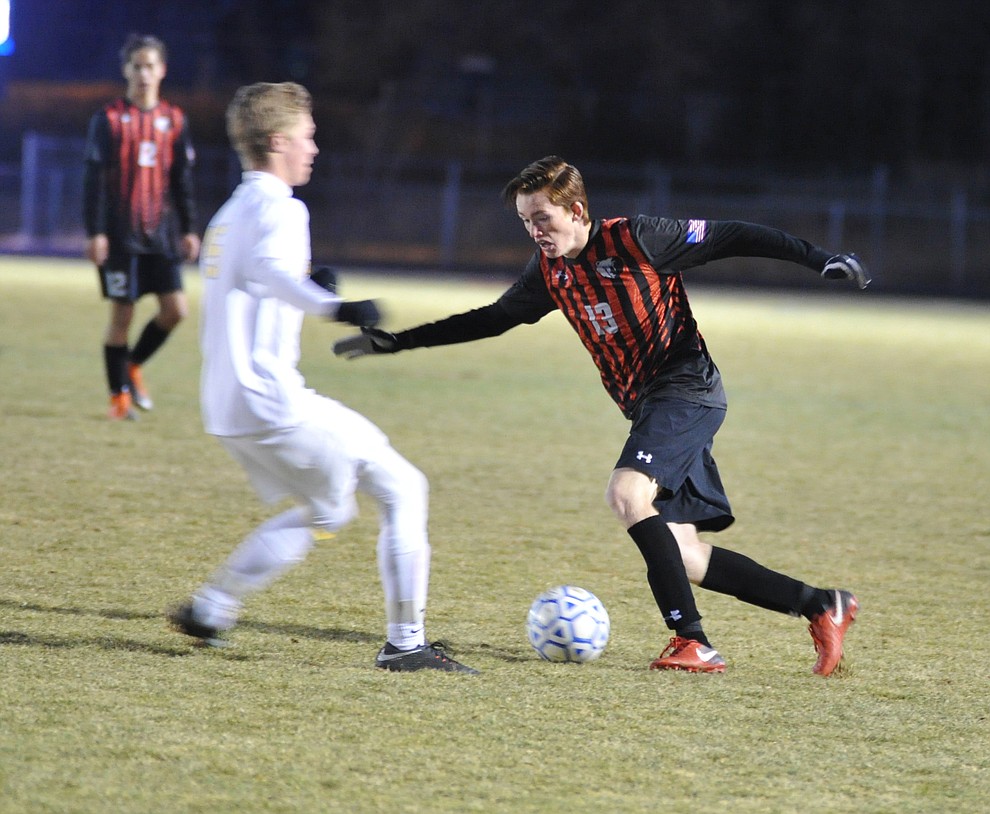 Bradshaw Mountain's Caleb Bryant looks to pass as the Bears traveled to cross town rival Prescott in a soccer double header Tuesday. (Les Stukenberg/Courier)