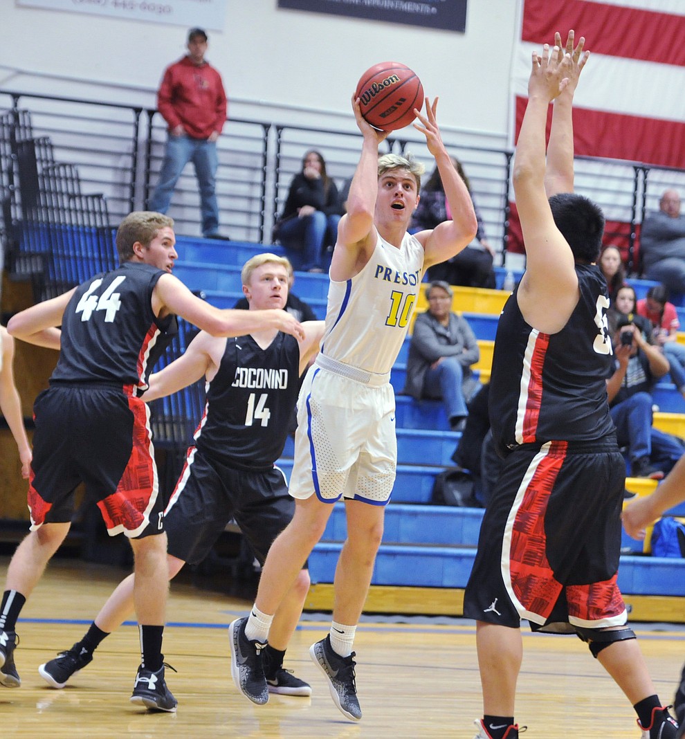 Prescott's Kody Jones takes a shot between three defenders as the Badgers hosted Coconino Tuesday night in the dome. (Les Stukenberg/Courier)