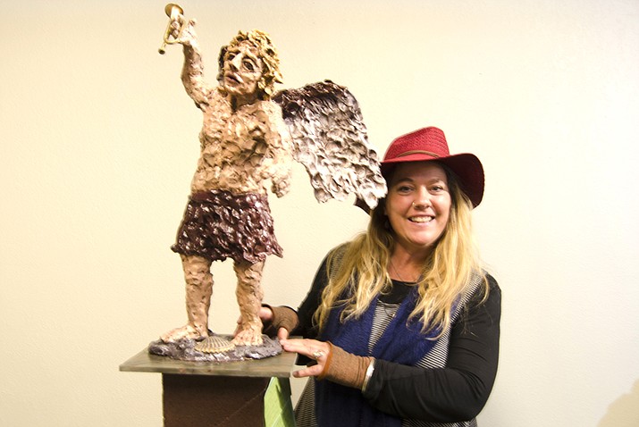 Janie Layers (left) has sculpted for more than 22 years. Her pieces consist mainly of people and animals. Layers makes her sculptures out of the same clay one would use for mugs or bowls. Then they’re fired and details are painted by hand. (VVN Halie Chavez)