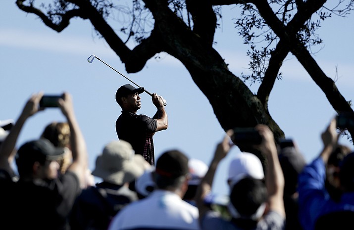 Tiger Woods watches his tee shot on the third hole hole of the South Course at Torrey Pines Golf Course during the first round of the Farmers Insurance Open golf tournament Thursday, Jan. 25, 2018, in San Diego. (Gregory Bull/AP)