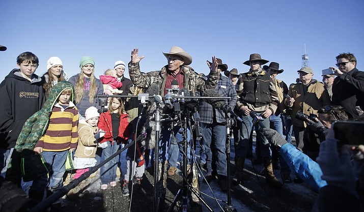 LaVoy Finicum, center, a rancher from Cane Beds, Arizona, speaks to reporters as his family looks on, left, during a news conference at Malheur National Wildlife Refuge Friday, Jan. 8, near Burns, Oregon. Ammon Bundy, the leader of a small, armed group occupying a national wildlife refuge, says the activists have no immediate plans to leave. (Rick Bowmer/The AP, file)