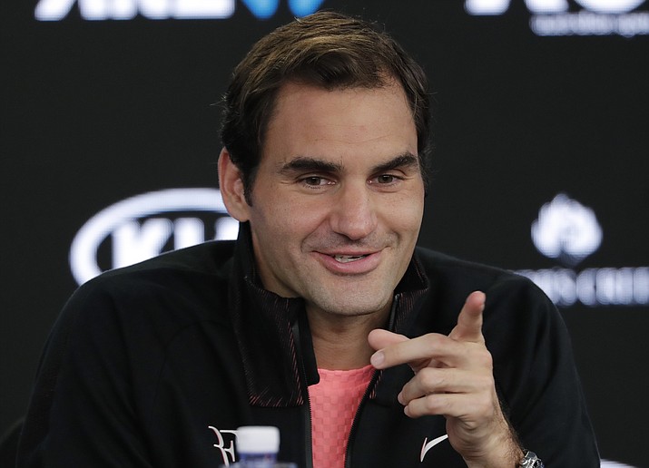 Switzerland's Roger Federer gestures during a press conference following his semifinal win over South Korea's Hyeon Chung who retired injured at the Australian Open tennis championships in Melbourne, Australia, Friday, Jan. 26, 2018. (Vincent Thian/AP)
