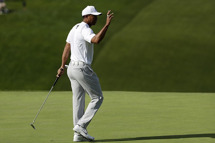 Tiger Woods reacts after making a putt on the 13th hole of the South Course at Torrey Pines Golf Course during the third round of the Farmers Insurance Open golf tournament, Saturday, Jan. 27, 2018, in San Diego. (Gregory Bull/AP)