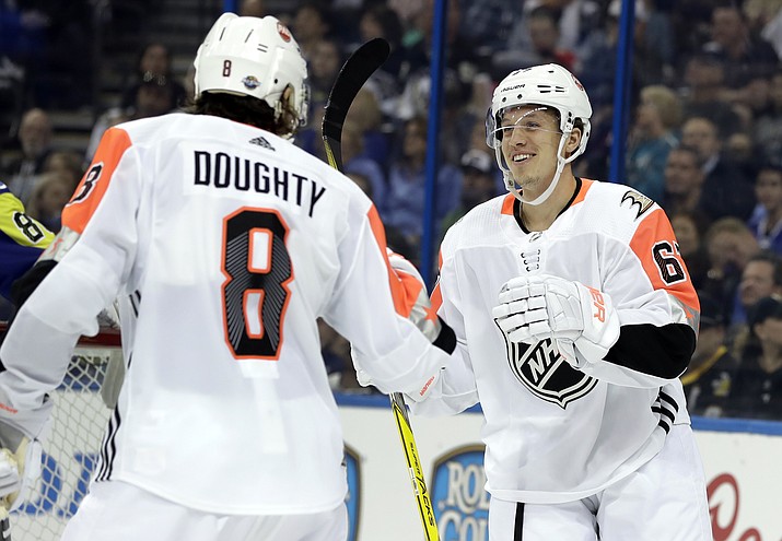 Pacific Division’s Rickard Rakell, right, of the Anaheim Ducks, is congratulated by Drew Doughty, of the Los Angeles Kings, after scoring during the NHL hockey All-Star game with the Atlantic Division Sunday, Jan. 28, 2018 in Tampa, Fla. (Chris O’Meara/AP)