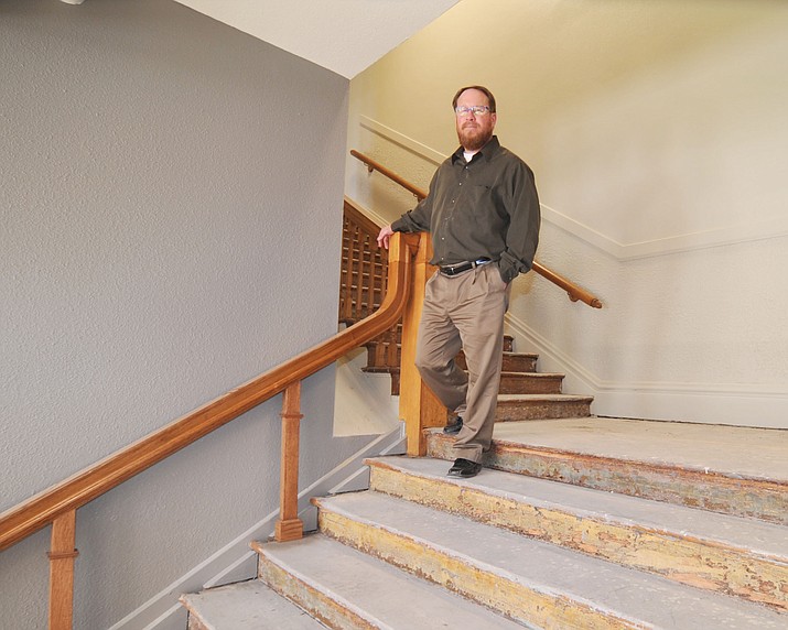 Superintendent Joe Howard walks down the main staircase at the former Washington Traditional School that will soon become the Prescott Unified School District offices. (Les Stukenberg/Courier)