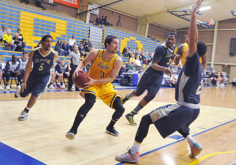 Embry Riddle's Ryan Skurdal looks to pass on the baseline as the Eagles hosted California Maritime Academy in Prescott Thursday evening. (Les Stukenberg/Courier)