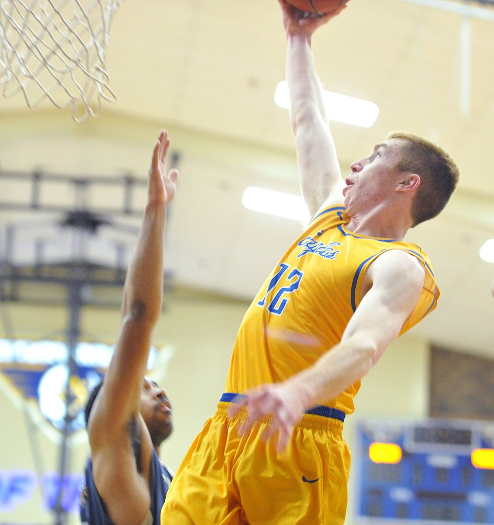 Embry Riddle's Nick Johnson drives for two points as the Eagles hosted California Maritime Academy in Prescott Thursday evening. (Les Stukenberg/Courier)