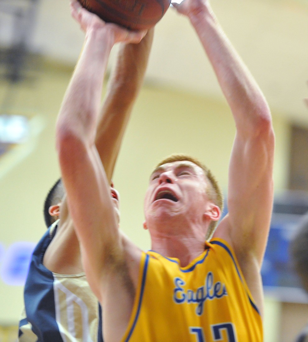 Embry Riddle's Nick Johnson gets fouled while shooting as the Eagles hosted California Maritime Academy in Prescott Thursday evening. (Les Stukenberg/Courier)