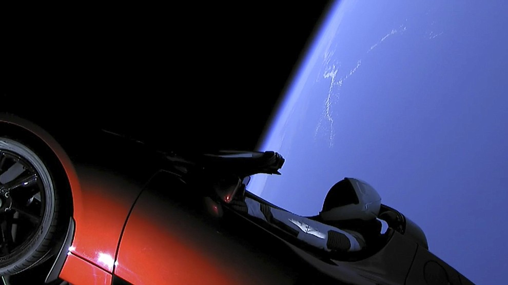 This image from video provided by SpaceX shows the company's spacesuit in Elon Musk's red Tesla sports car which was launched into space during the first test flight of the Falcon Heavy rocket on Tuesday, Feb. 6, 2018. (SpaceX via AP)