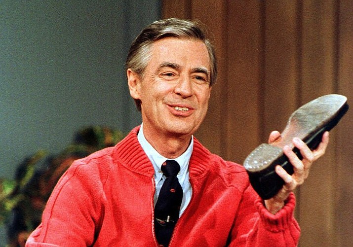 This June 28, 1989, file photo, shows Fred Rogers as he rehearses the opening of his PBS show “Mister Rogers’ Neighborhood” during a taping in Pittsburgh. The U.S. Postal Service plans to issue a new stamp featuring Mister Rogers, the children’s television icon known for his zip-up cardigan, sneakers and soothing manner. The Forever stamp will be unveiled March 23 in the same Pittsburgh public television station where “Mister Rogers’ Neighborhood” was produced. The stamp features Fred Rogers and the royal puppet King Friday XIII. (AP Photo/Gene J. Puskar, File)

