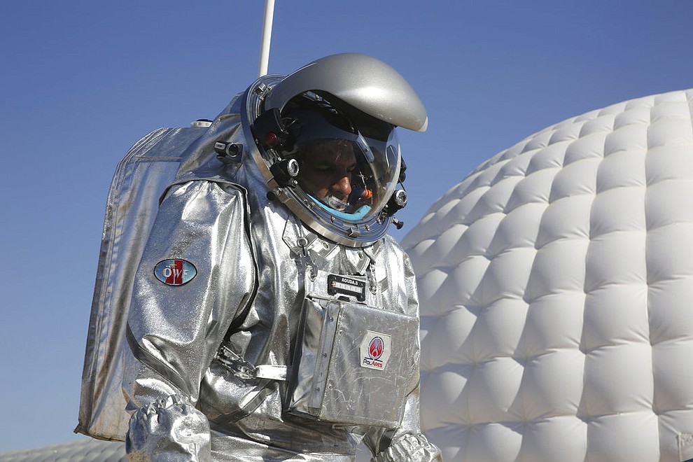 This Feb. 7, 2018, photo shows analog astronaut Kartik Kumar wearing an experimental space suit during a simulation of a future Mars mission in the Dhofar desert of southern Oman. The desolate desert in southern Oman resembles Mars so much that more than 200 scientists from 25 nations organized by the Austrian Space Forum are using it for the next four weeks to field-test technology for a manned mission to Mars. (AP Photo/Sam McNeil)