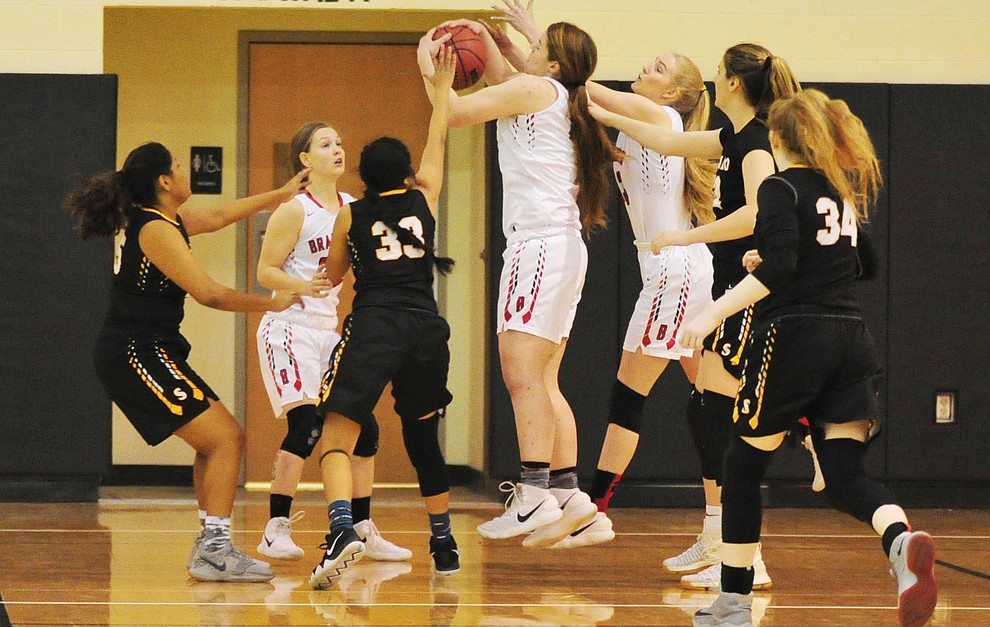 Bradshaw Mountain's Delanie Clark grabs an early rebound as the Bears hosted the Saguaro Sabercats for the play in game for the Arizona Interscholastic Association Thursday night in Prescott Valley. (Les Stukenberg/Courier)