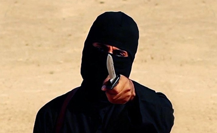 This image taken from a video released by the Islamic State shows a masked militant holding a knife as he speaks to the camera in a desert region before a brutal beheading. Two fighters who were part of the notorious kidnapping cell dubbed “The Beatles” for their British accents have been captured in Syria, a US defense official confirmed Thursday.