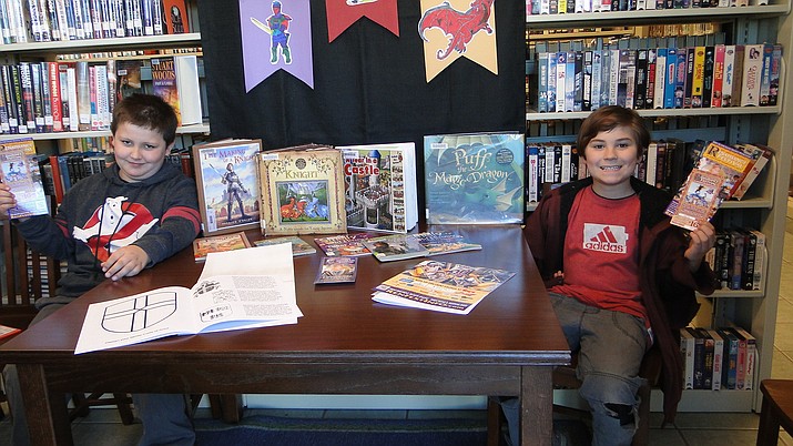 Rylan Hodges and Isaiah Karn have completed their 12 books under the guidance and supervision of Kairi Kline, library coordinator. (Courtesy)