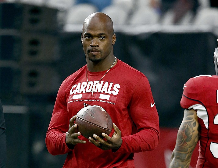 Arizona Cardinals running back Adrian Peterson watches warm ups prior to a game against the Los Angeles Rams on Sunday, Dec. 3, 2017, in Glendale. (Ross D. Franklin/AP, File)