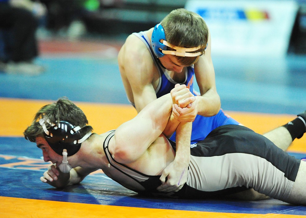 Chino Valley's J.C. Mortensen won his first round match during the first round of the Arizona Interscholastic Association wrestling tournament Friday at the Prescott Valley Event Center. (Les Stukenberg/Courier)