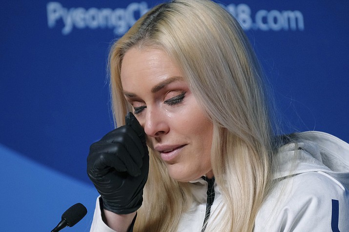Alpine skier Lindsey Vonn, of the United States, wipes away a tear after answering a question about her grandfather during a press conference ahead of the 2018 Winter Olympics in Pyeongchang, South Korea, Friday, Feb. 9, 2018. (J. David Ake/AP)
