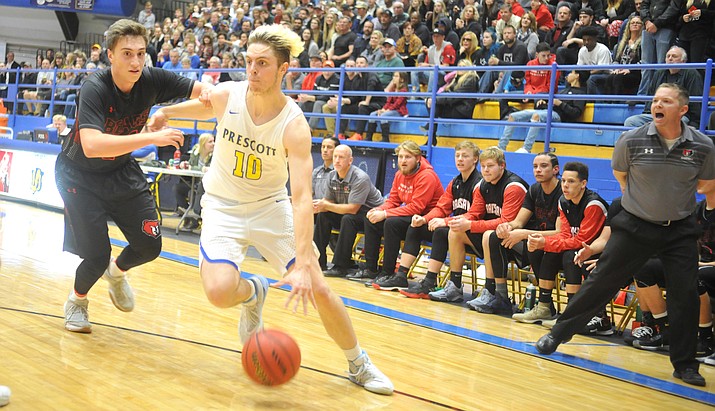 Prescott's Kody Jones (10) drives toward the lane as the Badgers host cross-town rival Bradshaw Mountain on Dec. 18, 2017, in Prescott. The No. 18 Badgers travel to No. 15 Tempe for the 4A conference play-in game Friday, Feb. 9, 2018. (Les Stukenberg/Courier, File)