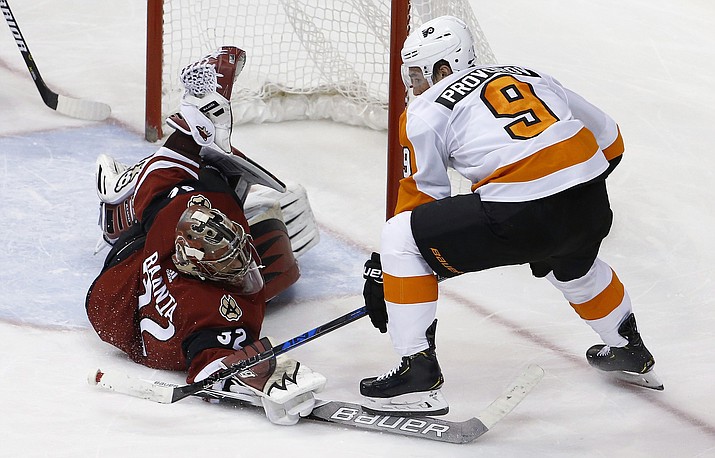 Arizona Coyotes goaltender Antti Raanta (32) makes a diving save on a shot by Philadelphia Flyers defenseman Ivan Provorov (9) during the second period of an NHL hockey game Saturday, Feb. 10, 2018, in Glendale, Ariz. 