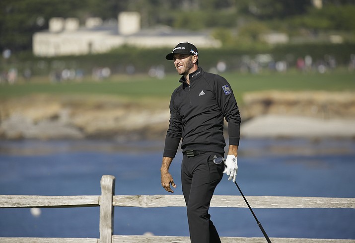 Dustin Johnson follows his shot from the seventh tee of the Pebble Beach Golf Links during the third round of the AT&T Pebble Beach National Pro-Am golf tournament Saturday, Feb. 10, 2018, in Pebble Beach, Calif. (Eric Risberg/AP)