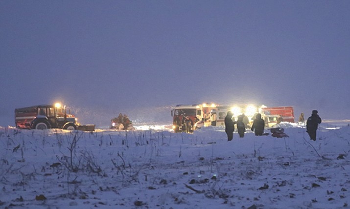 Employees of the Russian Ministry for Emergency Situations work at the scene of a AN-148 plane crash in Stepanovskoye village, about 40 kilometers (25 miles) from the Domodedovo airport, Russia, on Sunday, Feb. 11. Russia's Emergencies Ministry says a passenger plane crashed near Moscow, and fragments of it have been found. No survivors have been reported. (Photo by Russian Ministry for Emergency Situations photo via AP)