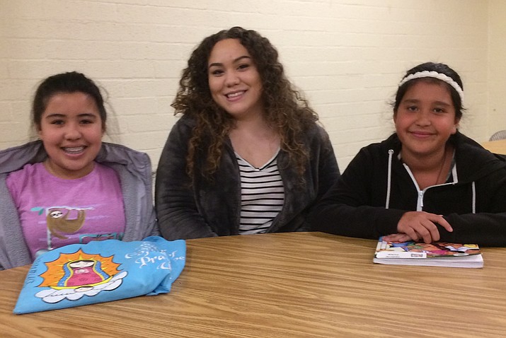 Elena Aragon, center, with two of her first-communion students at Sacred Heart Roman Catholic Church, from left, Brianna Chairez, 11, and Alexa Banda, 10. (Nanci Hutson/Courier)