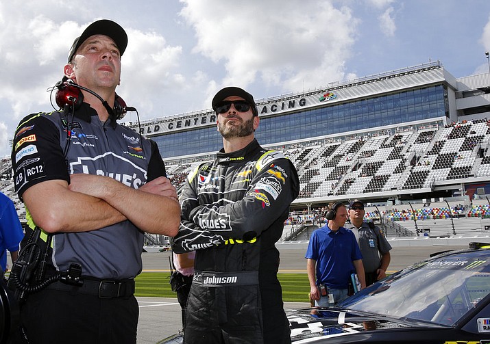 Crew chief Chad Knaus, left, and Jimmie Johnson watch the leaderboard during qualifying for the NASCAR Daytona 500 auto race at Daytona International Speedway on Sunday, Feb. 11, 2018, in Daytona Beach, Fla. (Terry Renna/AP)