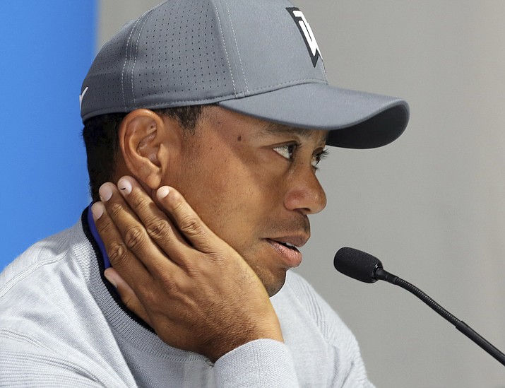 Tiger Woods talks about his charitable works off the course and his return to competitive golf in the Genesis Open at Riviera Country Club after an absence of 12 years, in Los Angeles Tuesday, Feb. 13, 2018. (Reed Saxon/AP)