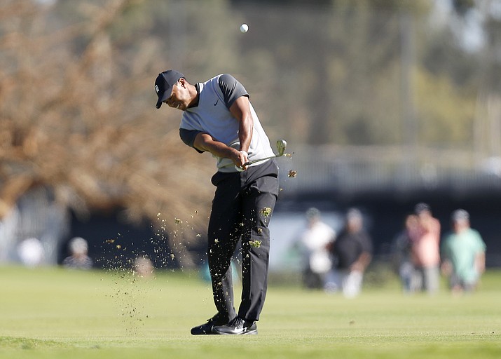 Tiger Woods hits his second shot on the third hole during the first round of the Genesis Open golf tournament at Riviera Country Club on Thursday, Feb. 15, 2018, in the Pacific Palisades area of Los Angeles. (Ryan Kang/AP)