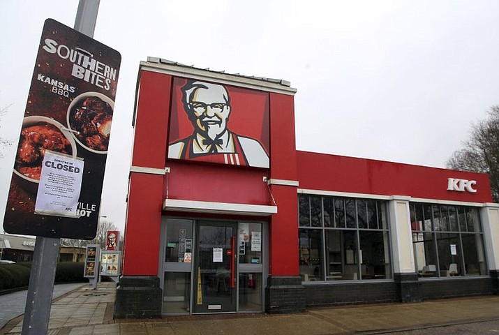 A closed sign is seen outside a KFC restaurant near Ashford, England, Monday, Feb. 19, 2018. Fast-food chain KFC has been forced to close most of its 900 outlets in Britain and Ireland because of a shortage of chicken The company is blaming “teething problems” with its new delivery partner, DHL. The company first apologized for the problems on Saturday. In an update Monday, it listed more than 200 stores as open, but did not say when the rest might reopen. (Gareth Fuller/PA via AP)