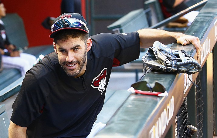 In this Oct. 2, 2017, file photo, right fielder J.D. Martinez smiles as he talks with another player during practice at Chase Field in Phoenix. A person familiar with the negotiations says slugger Martinez and the Boston Red Sox have agreed to a $110 million, five-year contract Monday, Feb. 19, 2018. (Ross D. Franklin/AP, File)