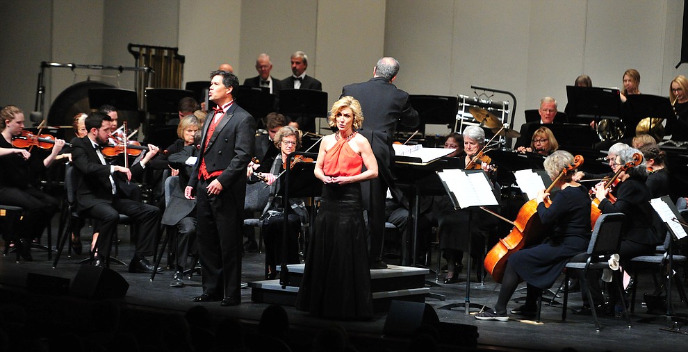 Mike Nache and Arlene Hardy perform a medley of Disney songs with the Prescott Pops Symphony for 2200 third to fifth grade students from around Yavapai County in the annual Music Memory Concert at the Yavapai College Performance Hall Thursday morning. (Les Stukenberg/Courier)