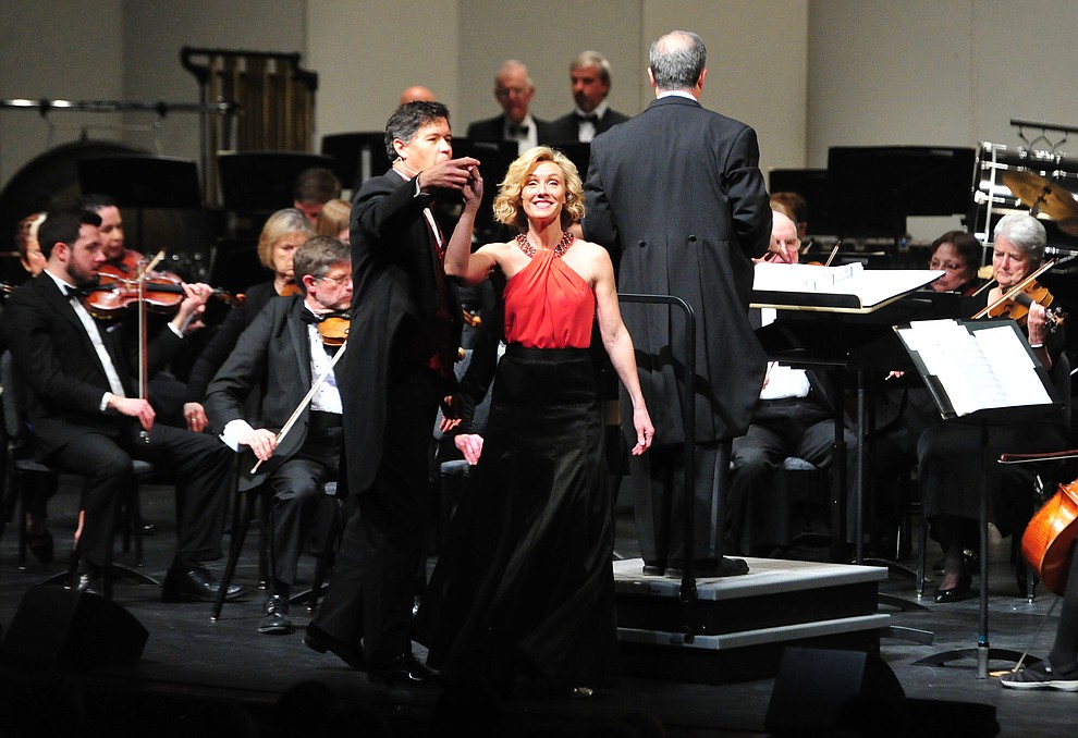 Mike Nache and Arlene Hardy perform a medley of Disney songs with the Prescott Pops Symphony for 2200 third to fifth grade students from around Yavapai County in the annual Music Memory Concert at the Yavapai College Performance Hall Thursday morning. (Les Stukenberg/Courier)