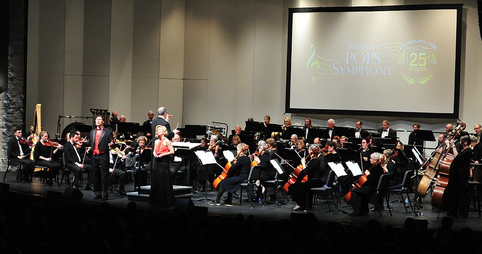 Mike Nache and Arlene Hardy perform a medley of Disney songs with the Prescott Pops Symphony for 2200 third to fifth grade students from around Yavapai County in the annual Music Memory Concert at the Yavapai College Performance Hall Thursday morning. (Les Stukenberg/Courier)