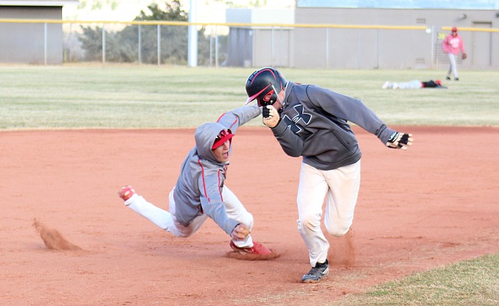 Mingus senior Andrew Kulis dives to tag out sophomore Chris Mathe during practice on Friday afternoon. Kulis earned the win as a pitcher in the Marauders’ season opening 15-4 victory at Combs and hit two triples. (VVN/James Kelley)