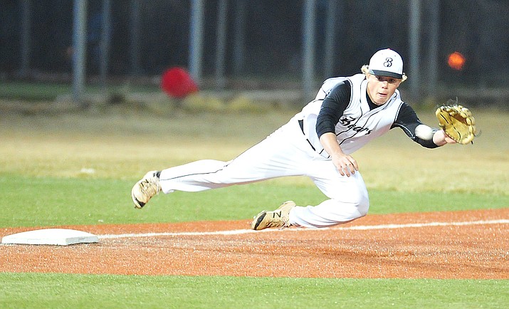 Bradshaw Mountain's Jeffrey Walker makes a play at third as the Bears take on Coconino in a rare night time baseball game in Prescott Valley Thursday. (Les Stukenberg/Courier)