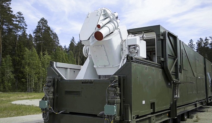 In this video grab provided by RU-RTR Russian television via AP television on Thursday, March 1, 2018, a Russian military truck with a laser weapon mounted on it is shown at an undisclosed location in Russia. President Vladimir Putin declared Thursday that Russia has developed new nuclear weapons, claiming they can’t be intercepted by any enemy. (RU-RTR Russian Television, via AP)