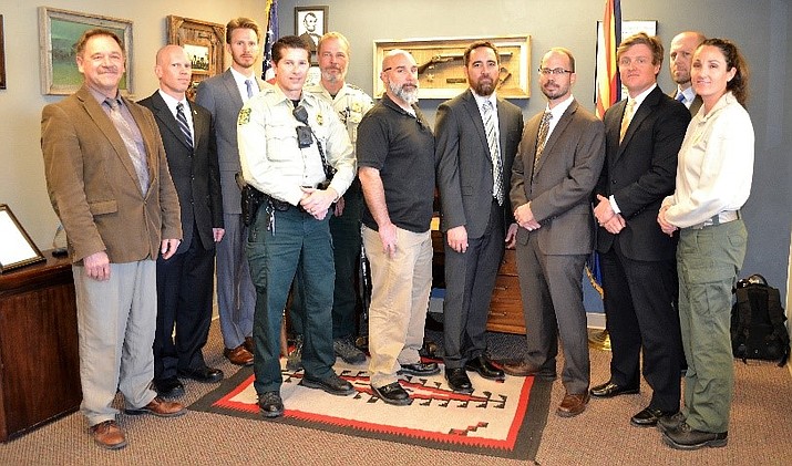 Sheriff Mascher (left) stands with federal officers just sworn by the Honorable Judge David Mackey conducting the Oath of Office for State Peace Officer Certification. Personnel include United States Department of Homeland Security-Investigations, the United States Postal Inspector, the United States Forest Service, and FBI.