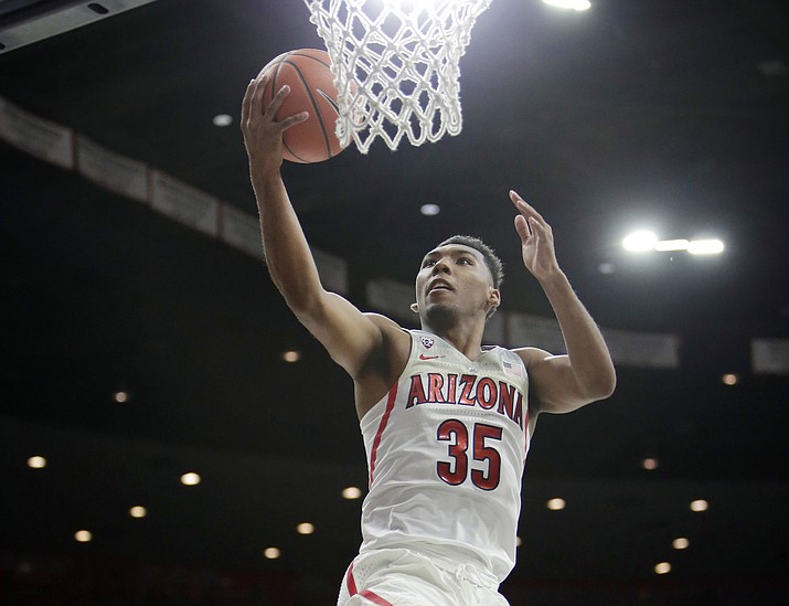 In this March 3, 2018, file photo, Arizona guard Allonzo Trier (35) scores against California during the second half in Tucson. Trier was selected to the AP All-Pac-12 team on Tuesday, March 6, 2018. (Rick Scuteri/AP, File)