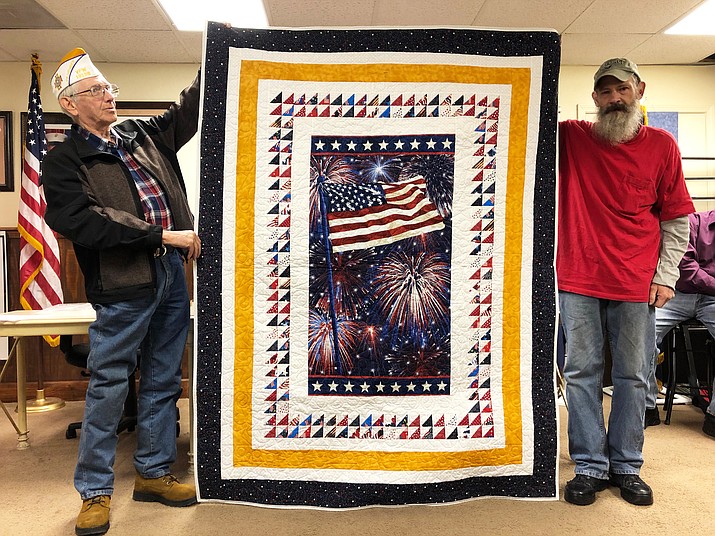 Paul Sanger (right), a U.S. Air Force veteran from Williams was honored March 2 with a quilt by the Quilt of Valor Foundation. (Wendy Howell/WGCN)