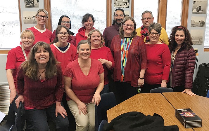 Mile High Middle School faculty and staff, in the Prescott Unified School District, showed support for pay raises by wearing red Wednesday. From left, front row, are: Tami Law, Molly Littrell; middle row: Lisa Evans, Jessica Kiehl, Lisa Groves, Stephanie Grotbeck, Christine Felton, and Helen Wanamaker; back row: Wendy Tollefsen, Christina Jones, Jeannette Bray, Josiah Ramirez and Andy Andre. (Courtesy)